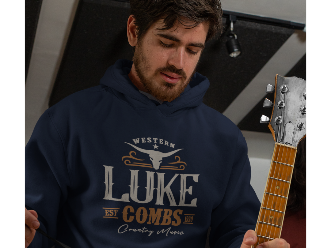 Man wearing navy hoodie with a western luke combs graphic design