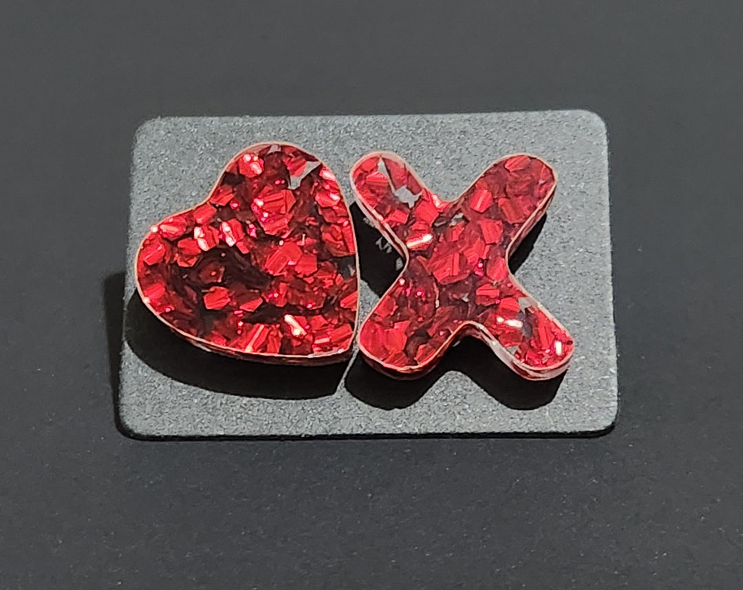 Red chunky glitter in shape of X and O stud earrings
