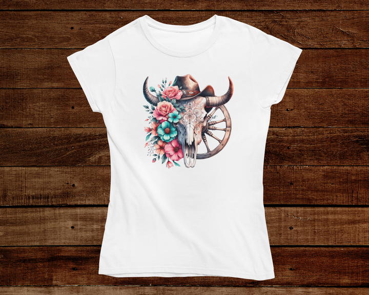 White t-shirt with a bull skull and floral design on a wooden background