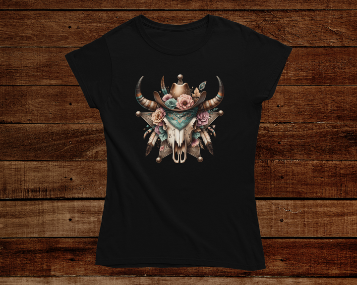 Black t-shirt with a floral and horn design on a wooden background