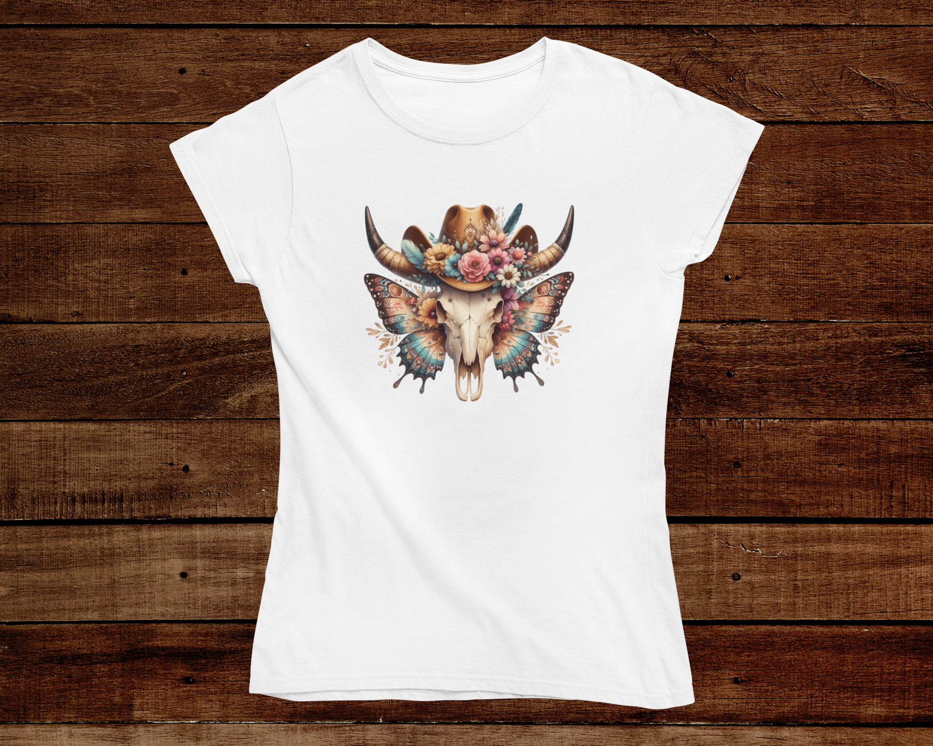 White t-shirt with a decorative bull skull design on a wooden background