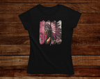 Black t-shirt with a colorful graphic design on a wooden background