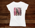 White t-shirt with a graphic design on a wooden background