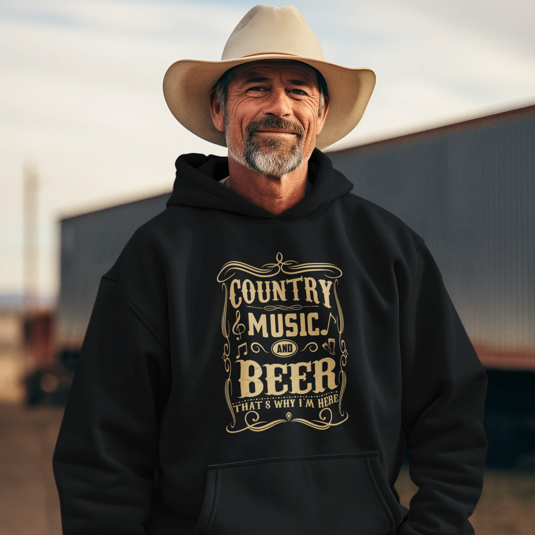Man wearing a black hoodie with 'Country Music & Beer' text, standing outdoors.